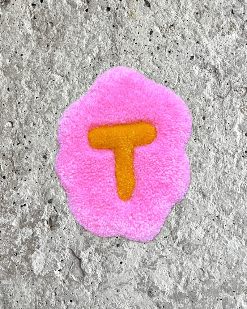 litera T
